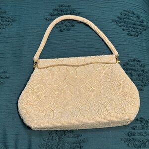 Vintage ivory seed bead handbag 1940-1960? 
Spring loaded opening